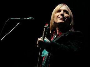 In this June 16, 2006 file photo, Tom Petty performs at the Bonnaroo Music & Arts Festival in Manchester, Tenn. Petty has died at age 66. Spokeswoman Carla Sacks says Petty died Monday night, Oct. 2, 2017, at UCLA Medical Center in Los Angeles after he suffered cardiac arrest. (AP Photo/Mark Humphrey, File)
