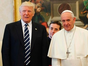 Pope Francis (R) stands with US President Donald Trump during a private audience at the Vatican on May 24, 2017.  (EVAN VUCCI/AFP/Getty Images)