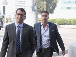Mark Salling (R) arrives for a court appearance at United States Courthouse - Central District of California on June 3, 2016 in Los Angeles, California. Salling is turning himself in to federal authorities and is scheduled to be arraigned on two charges of child pornography. (Photo by Frederick M. Brown/Getty Images)