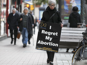 Protestor walk in front of an abortion clinic  in downtown Ottawa, Ontario  September 26, 2012.   (ANDRE FORGET/POSTMEDIA)