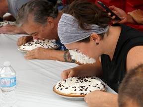 Kingston city councillors Mary Rita Holland and Jim Neill compete in the second annual City of Kingston Workplace Pie Eating contest at Springer Market Square on Wednesday October 4 2017. Ian MacAlpine /The Whig-Standard/Postmedia Network
