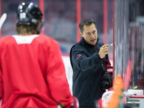 Coach Guy Boucher gives instructions as the Ottawa Senators practise at the Canadian Tire Centre on Sept. 21, 2017. (Wayne Cuddington/Postmedia)