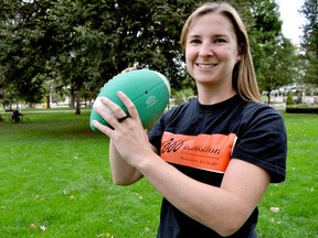Karen Dillane, a City of London recreation supervisor, holds a football in Victoria Park. The ParticipAction 150 playlist makes a stop in London Oct. 11 during the in motion Community Challenge, an annual campaign that encourages Londoners to get moving through physical activity. (CHRIS MONTANINI, Londoner)