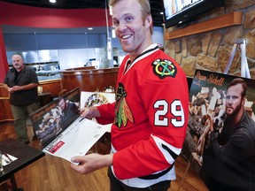 Former NHLer Bryan Bickell is all smiles as the Peterborough Humane Society, Pet Supply Warehouse and Connor Windows and Doors launched the first ever Shelter Shots Calendar on Sept. 26, 2017 at Ricky's All Day Grill in Peterborough, Ont. (CLIFFORD SKARSTEDT/PETERBOROUGH EXAMINER)