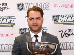 Capitals goalie Braden Holtby poses with the William M. Jennings Trophy in June after his team allowed the fewest regular-season goals last season. (BRUCE BENNETT/Getty Images files)