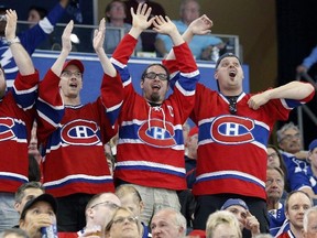 Fans of the Montreal Canadiens celebrate a goal against the Tampa Bay Lightning in Tampa, Fla., on Thursday, March 31, 2016. (THE CANADIAN PRESS/AP-Mike Carlson)