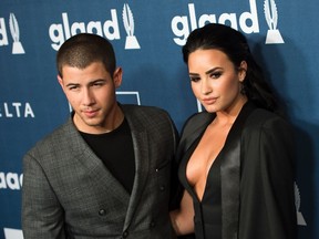 Nick Jonas (L) and Demi Lovato attend The 27th Annual GLAAD Media Awards in Beverly Hills, California, on April 2, 2016. / AFP / VALERIE MACON (Photo credit should read VALERIE MACON/AFP/Getty Images)