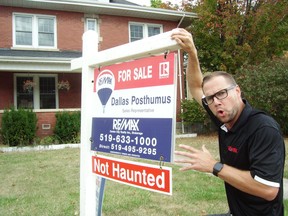 Realtor Dallas Posthumus has a Boo! moment to scare up interest in a listing. His publicity stunt has attracted attention, he says, and there's a conditional offer on the property. (Eric Bunnell/Contributed)