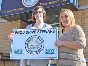 TIM MEEKS/THE INTELLIGENCER
Sarah Kring (right), Gleaners Foodbank volunteer co-ordinator, and volunteer Natalie Lake, a Social Service Worker student at Loyalist College, promote the annual Food Drive's Neighbourhood Steward Program. The Gleaners Food Drive is set for October 15 throughout Belleville.