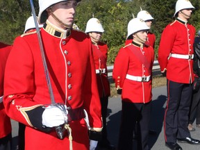 Royal Military College Officer Cadet Thomas Levert with the sword named in honour of Captain Nochola Goddard.
The True Patriot Love Foundation, in partnership with Canso Investment Counsel Ltd., Honoured fallen Canadian soldier Captain Nichola Goddard with Highway of Heroes Plaque Unveiling on Thursday October 5, 2017 at the Ontario Street bridge overlooking the Highway of Heroes in Cobourg, Ont. 
Goddard, who was killed during combat while in Afghanistan in 2006.
The grassroots movement honouring the fallen started when the first four Canadians came home for the final time in 2002 with Canadians standing on bridges from CFB Trenton to Toronto to pay their respects.
TPL has commissioned the placement of 12 commemorative plaques on Highway of Heroes overpasses to honour the brave men and women who made the ultimate sacrifice.
Pete Fisher/Northumberland Today/Postmedia Network