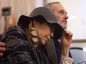 Chief Marcia Brown Martel, a member of the Temagami First Nation near Kirkland Lake, Ont., sits with her husband Raymond Martel at a news conference in Toronto on Feb. 14, 2017 after an Ontario judge ruled Canada failed to take reasonable steps to prevent thousands of on-reserve children who were placed with non-native families from losing their Indigenous heritage during the '60s Scoop. (Chris Young/The Canadian Press)