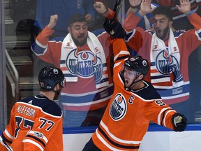 Edmonton Oilers' Connor McDavid celebrates with Oscar Klefbom his first goal of the game against the Calgary Flames during NHL action at Rogers Place in Edmonton on Oct. 4, 2017. (Ed Kaiser/Postmedia)