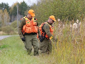 Members of the OPP Emergency Response Team (ERT) search an area in Estaire, Ont. on Thursday October 5, 2017. Police are continuing their investigation into the murder of Sheri-Lynn McEwan that started on October 7, 2013. The OPP Emergency Response Team (ERT), an OPP helicopter and a drone were used to conduct an extensive evidence search of the crime scene and surrounding area. John Lappa/Sudbury Star/Postmedia Network