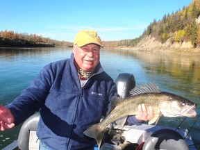 Neil with his 28-inch “black beauty” walleye