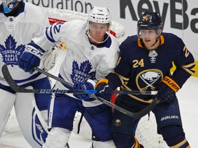 Buffalo Sabres forward Hudson Fasching and Toronto Maple Leafs defenceman Martin Marincin fight for position during an NHL pre-season game on Sept. 23, 2017. (AP Photo/Jeffrey T. Barnes)