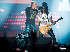 Axl Rose, left, lead singer of the Guns N' Roses, performs with Slash at Parken Stadium, Copenhagen, Denmark, June 27, 2017.(MADS JOAKIM RIMER RASMUSSEN/AFP/Getty Images)