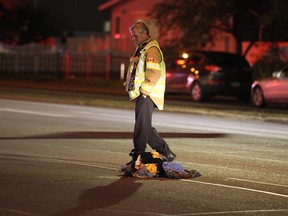 Police have blocked off 82 Street between 127 Avenue and 130 Avenue. A truck hit a pedestrian and took off, witnesses said Thursday night.David Bloom/Postmedia