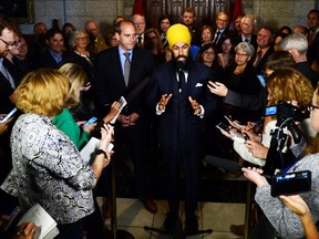 NDP Leader Jagmeet Singh stands with his newly announced NDP Parliamentary leader, Guy Caron, as he speaks to reporters in the foyer of the House of Commons, in Ottawa on Wednesday, Oct. 4, 2017. THE CANADIAN PRESS/Sean Kilpatrick
