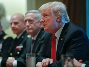 President Donald Trump, right, speaks during a briefing with senior military leaders in the Cabinet Room of the White House in Washington, Thursday, Oct. 5, 2017, with National Security Adviser H.R. McMaster, left, and Defense Secretary Jim Mattis, center. (AP Photo/Pablo Martinez Monsivais)