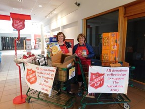 Helen Daniels, a volunteer, stands with Shannon Daniels (L), Community and Family Services Coordinator with the Salvation Army.