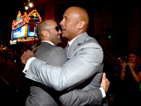 Jason Statham (L) and Dwayne 'The Rock' Johnson attend Universal Pictures' 'Furious 7' premiere at TCL Chinese Theatre on April 1, 2015 in Hollywood, California. (Photo by Alberto E. Rodriguez/Getty Images)