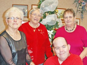 Members of OPAL, a Self Help Group for the Physically Challenged, made a donation to the Angel Tree/ Christmas Toy Drive during their annual Christmas luncheon in December of 2014. Accepting the donation was Carol Siemon (left), joined by OPAL members Yolanda Graf, Graham Jibb and Grace Brodhagen. ADVOCATE FILE PHOTO