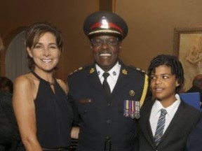 Toronto Police Chief Mark Saunders, centre, wife Stacey and son Graham on Sept. 29, 2016. (Jack Boland/Toronto Sun)