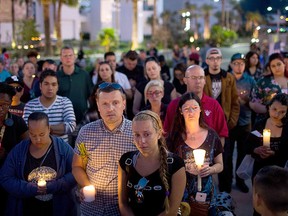 Mourners attend a candlelight vigil at the corner of Sahara Ave. and Las Vegas Blvd., for the victims of Sunday night's mass shooting, Oct. 2., 2017 in Las Vegas. (Drew Angerer/Getty Images)