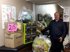 George O'Mahony poses with socks raised during Socktober in Sarnia in 2016. The socks were donated to the Inn of the Good Shepherd. (Handout)