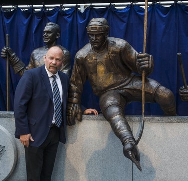 Toronto Maple Leafs alumnus Wendel Clark poses for a photo beside his bronze statue for Leafs Legends Row outside of the Air Canada Centre on Thursday, Oct. 5, 2017. (Ernest Doroszuk/Toronto Sun)