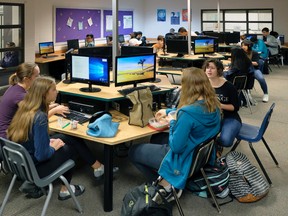 Students in the school library during lunch hour at Archbishop MacDonald High School in Edmonton on Friday October 6, 2017. (PHOTO BY LARRY WONG/POSTMEDIA)