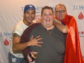 From left to right: Musical artist Dan Smyers of Dan + Shay, comedian Ralphie May and Warner Music Nashville Chairman/CEO John Esposito take photos at the T.J. Martell roast of Warner Music Nashville Chairman/CEO John Esposito on April 17, 2017 in Nashville, Tennessee. (Rick Diamond/Getty Images for T.J. Martell)