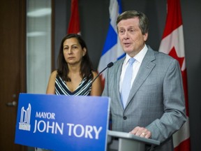 Toronto Mayor John Tory, joined by Coun. Ana Bailão, addresses media at City Hall on Monday, June 12, 2017. (Ernest Doroszuk/Toronto Sun)