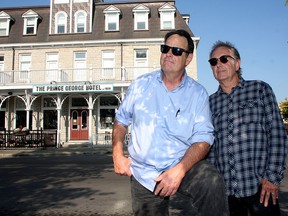 Legendary Canadian actor Dan Aykroyd, left, and Peter Lloyd, the former manager of Dollar Bill's, in front of the Prince George Hotel on Tuesday.   (Ian MacAlpine/The Whig-Standard)