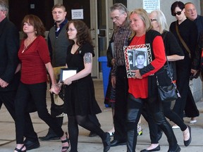 Ken Abrams, left, Deb Abrams, mother of Adam Kargus, her son Shane Kargus and daughter Paige Parkes leave the London courthouse. Adam Kargus was beaten to death at Elgin-Middlesex Detention Centre by Anthony George. (MORRIS LAMONT, The London Free Press)