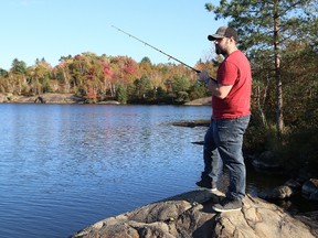 John Lappa/Sudbury Star/Postmedia Network
Josh Ackerland tries his luck at fishing at Ramsey Lake in Sudbury on Friday. It will rain on Saturday, but sunny skies are predicted to return on Sunday and Monday to finish the Thanksgiving weekend.