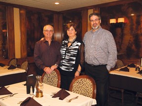 George and Helen Roumanes, and their son, Sam, stand in the dining area of the family restaurant, Mr. Prime Rib, in Sudbury, Ont. on Friday October 6, 2017. The restaurant has been around for 50 years. John Lappa/Sudbury Star/Postmedia Network