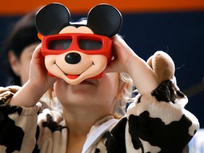 Three-year-old Matilda Griffin of Trenton checks out a Mickey Mouse Viewfinder at the Nostalgia and Pop Culture Festival held at the Belleville Armouries on Saturday October 7, 2017 in Belleville, Ont. Tim Miller/Belleville Intelligencer/Postmedia Network