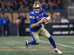 Winnipeg Blue Bombers quarterback Matt Nichols (15) looks for his receivers during the first half of CFL action against the Hamilton Tiger-Cats in Winnipeg Friday, October 6, 2017. THE CANADIAN PRESS/John Woods