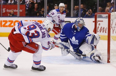 Toronto Maple Leafs�Frederik Andersen G (31) makes a big body save on New York Rangers Mika Zibanejad C (93)  in the second period in Toronto on Saturday October 7, 2017. Jack Boland/Toronto Sun/Postmedia Network