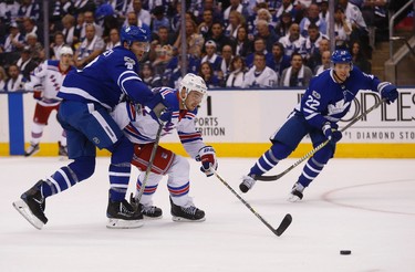 Toronto Maple Leafs�Rob Gainsay D (2) drapes himself on New York Rangers Kevin Shattenkirk D (22) in the second period in Toronto on Saturday October 7, 2017. Jack Boland/Toronto Sun/Postmedia Network