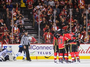 The Flames celebrate Micheal Ferland’s goal against the Winnipeg Jets during their game at Scotiabank Saddledome last night. (Getty Images)
