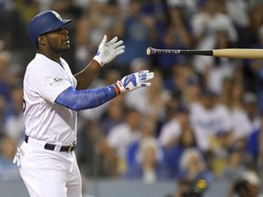 Los Angeles Dodgers’ Yasiel Puig celebrates after a single against the Arizona Diamondbacks during Game 2 of the National League Division Series in Los Angeles, Saturday, Oct. 7, 2017. (AP Photo/Mark J. Terrill)