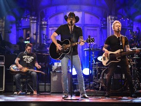 In this photo provided by NBC, Jason Aldean performs 'I Won’t Back Down' on Saturday Night Live Saturday, Oct. 7, 2017, in New York. (Will Heath/NBC via AP)