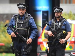 Armed police at the scene on Cromwell Gardens in London, after a car plowed into people outside the Natural History Museum in London, Saturday Oct. 7, 2017. (Victoria Jones/PA via AP)