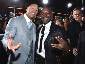 In this April 1, 2015, file photo, Dwayne Johnson, left, and Tyrese Gibson arrive at the premiere of ‘Furious 7’ at the TCL Chinese Theatre IMAX in Los Angeles. (Photo by John Shearer/Invision/AP, File )