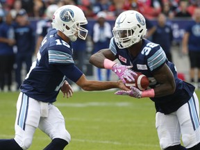 Toronto Argonauts QB Ricky Ray (15) hands off to James Wilder Jr. during the first half at BMO Field in Toronto on Saturday October 7, 2017. (Jack Boland/Toronto Sun/Postmedia Network)