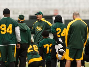 Edmonton's head coach Jason Maas (centre) speaks with his players at the end of an Edmonton Eskimos practice at Commonwealth Stadium in Edmonton, Alberta on Friday, October 6, 2017. Ian Kucerak / Postmedia