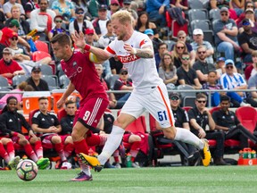 Ottawa Fury FC #9 Carl Haworth fights for the ball against FC Cincinnati #51 Sem De Wit at TD Place Sunday October 8, 2017. (Ashley Fraser/Postmedia Network)