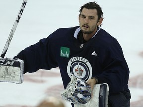 Connor Hellebuyck loses the lid during a break at Winnipeg Jets practice in Winnipeg on Mon., Oct. 2, 2017. Hellebuyck is going to make his first start of the season against the Oilers on Mon., Oct. 9. 2017. Kevin King/Winnipeg Sun/Postmedia Network